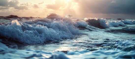Coastline with waves during sunset. Waves during storm. Wave reaches beach. Splashing ocean waves. Rising storm near seaside.