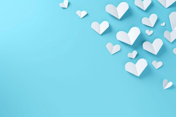 Valentines Day simple background with white paper hearts on blue background. Love concept. Greeting card with copy space.