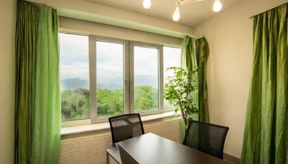 bright office with green curtains and nature view
