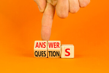 Q and A questions and answers symbol. Turned wooden cubes and changed the word questions to answers. Beautiful orange background, copy space. Business Q and A questions and answers concept. - obrazy, fototapety, plakaty