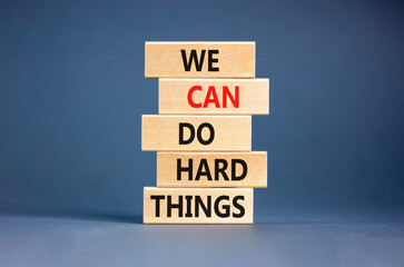 We can do hard things symbol. Concept words We can do hard things on wooden blocks. Beautiful grey table grey background. Business, we can do hard things concept. Copy space.