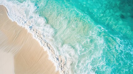 Fototapeta na wymiar Beautiful sandy beach and soft blue ocean wave from top view , Summer seascape background.