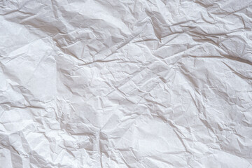 Texture of crumpled white paper. Wrinkled, abstract background.