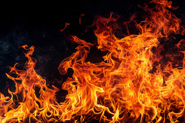 Fototapeta na wymiar Fire flames on dark background. Burning flame effect
