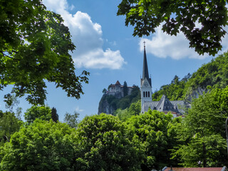 Panoramic view of St. Martina Parish Church and medieval castle at Lake Bled, Upper Carniola,...