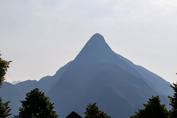 Scenic view of mount Svinjak seen from Bovec in Julian Alps, Slovenia. Jagged contours of majestic...