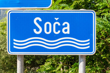 Sign of Soca (Isonzo) in Julian Alps, near Bovec, Slovenia, Europe. Signpost is mounted on post and...
