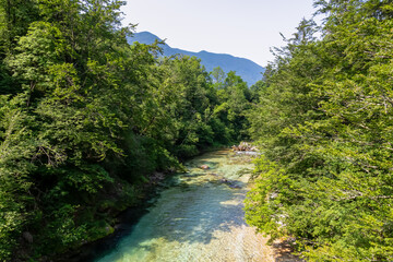 Scenic view of green hills and Soca river in Bovec, Triglav National Park, Slovenia. Magnificent...