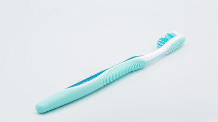 Toothbrush closeup against white background.