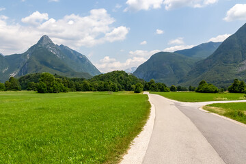 Scenic hiking trail to mount Svinjak seen from Bovec, Julian Alps, Slovenia. Jagged contours of...