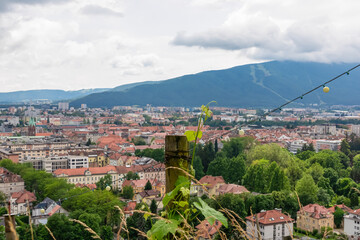 Fototapeta na wymiar Majestic aerial view from Piramida (Pyramid Hill) offers breathtaking panorama of charming old town of Maribor, Slovenia, Europe. Stunning vantage point is gracefully enveloped by verdant vineyards