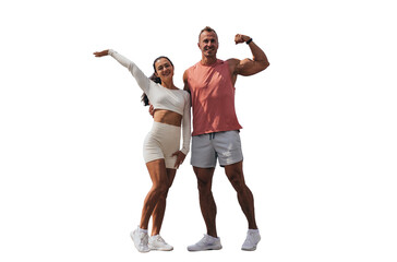 Energetic fitness duo flexing muscles and posing joyfully on a black background