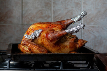 Cooked Christmas turkey on a baking sheet.
