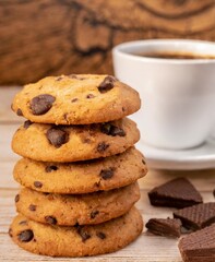 Coffee and cookies isolated on table closeup