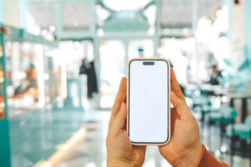cell phone mockup blank white screen.woman hand holding texting using mobile on desk at coffee shop.background empty space for advertise.work people contact marketing business,technology