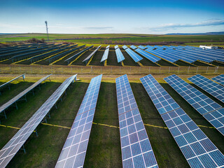 Solar panel produces green, environmentaly friendly energy from the setting sun. Aerial view from...