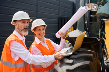 Construction specialists conducting inspection of building site
