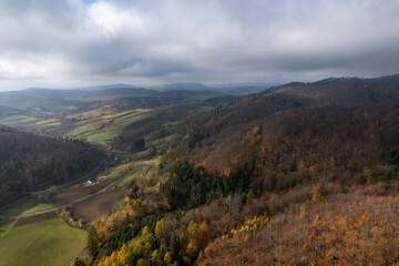Fototapeta premium Southern Poland landscape, mountains, autumn, day, sun, sky, clouds, Klodzka Basin, dramatic and majestic scenery