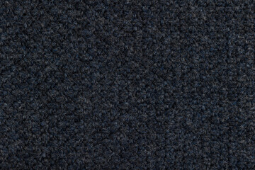 Dark blue knitted texture. Knitted wool background.