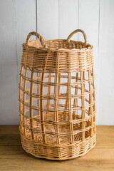 Tall wicker basket with two handles