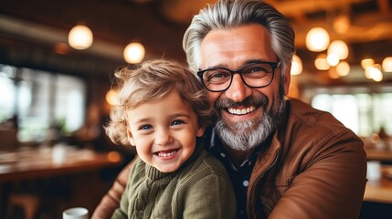 Father son bond hipster son embracing senior father at home for father s day celebration