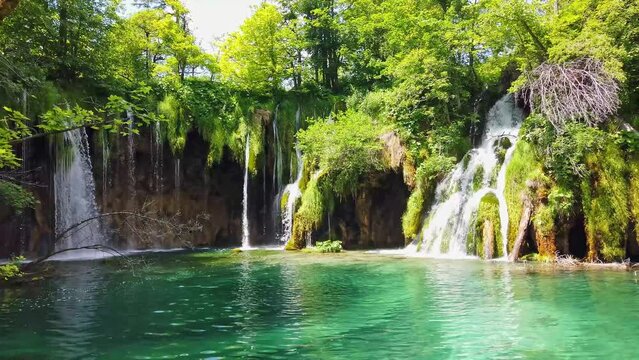 Majestic view on waterfall with turquoise water in the Plitvice Lakes National Park, Croatia. Europe. One of the oldest and largest national parks in Croatia. UNESCO World Heritage