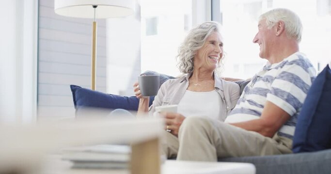 Happy, Love And Senior Couple On A Sofa With Coffee Break, Connection And Romance At Home Together. Support, Gratitude And Old People Embrace In A Living Room Enjoy Relationship, Tea And Retirement