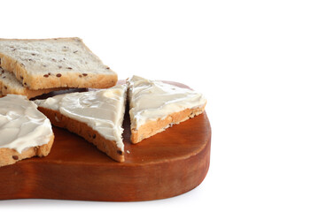 Wooden board of tasty toasts with cream cheese on white background