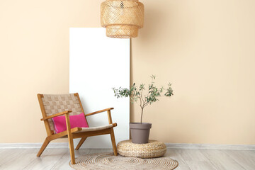 Stylish wicker armchair with cushion and houseplant near beige wall