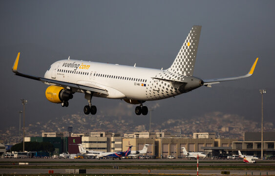 BARCELONA, EL PRAT, SPAIN - JANUARY 24, 2020: Image of Airplane of Vueling airlines approaches for landing