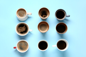 Many cups of hot coffee on blue background