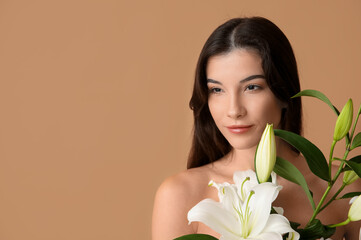 Beautiful young woman with white lily flowers, closeup