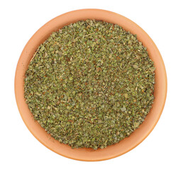 Dry chopped marjoram leaves in clay pot isolated on white background