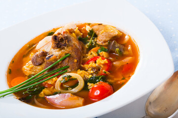 Soup Kharcho – traditional dish of Georgian cuisine. Rich mutton broth with rice and tomatoes