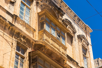 Fototapeta na wymiar Traditional maltese balconies in the old town of Valletta, Malta