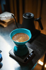 Barista preparing black coffee using alternative ways of brewing coffee