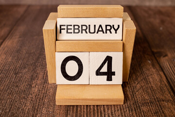 February 4 calendar date text on wooden blocks with customizable space for text or ideas.