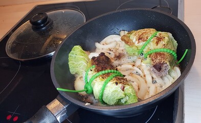  savoy cabbage and fill with beef sausage Prepare tasty in the pan