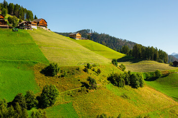 Breathtaking Dolomite Alps rise majestically, showcasing their rugged beauty under pristine sky.