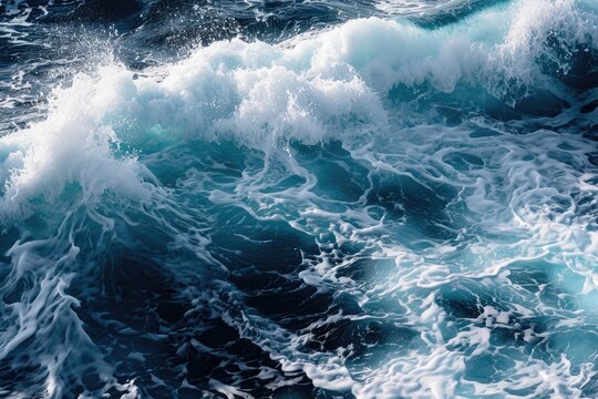 Ocean wave texture with foamy whitecaps and blue water.