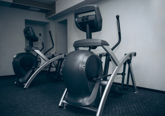 Fototapeta na wymiar elliptical cross trainer in the gym