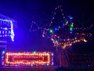 Christmas lights in the night on the countryside.