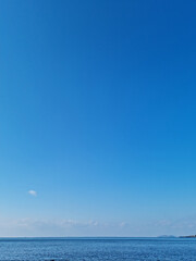 Fototapeta premium Blue gradient sky with blue sea view