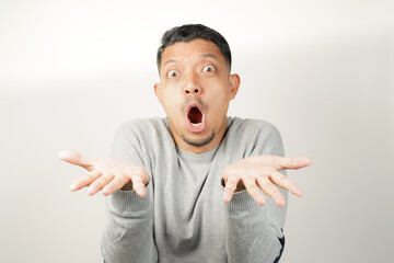 surprised, shocked expression of Asian Man with both fingers open, isolated background