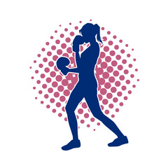 Silhouette of woman boxing athlete in action pose. Silhouette of a female wearing boxing gloves for boxing sport.