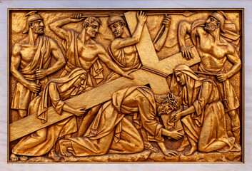 The Carrying of the Cross – Fourth Sorrowful Mystery. A relief sculpture in the Basilica of Our...