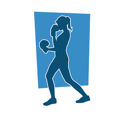 Fototapeta na wymiar Silhouette of woman boxing athlete in action pose. Silhouette of a female wearing boxing gloves for boxing sport.