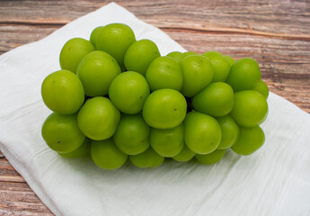 Cluster of ripe shine muscat large green korean grapes