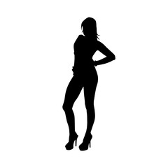 Fototapeta premium Silhouette of a young slim female model in tight outfit. Silhouette of a slim woman in feminine pose. 