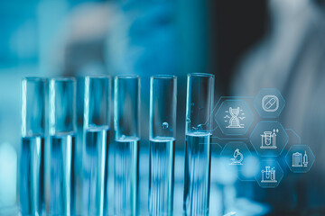 Technician holding tube test in the research laboratory, chemist's hand taking a solution sample tube from a rack with machines of analysis in the lab, Dripping liquid from pipette into tube.